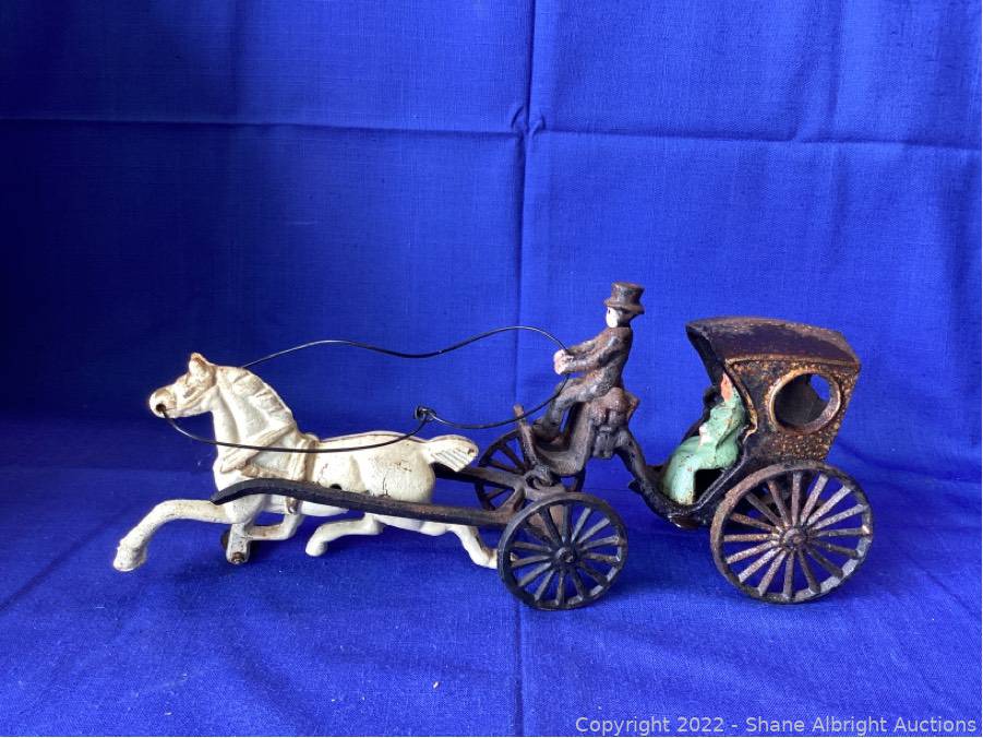 Antique cast iron horse best sale and buggy