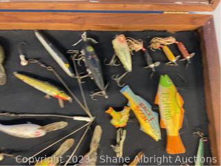 Wooden fishing lures in display case Auction