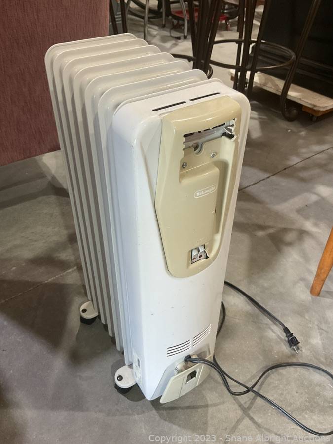 DeLonghi Rolling Floor Space Heater. Auction Shane Albright Auctions