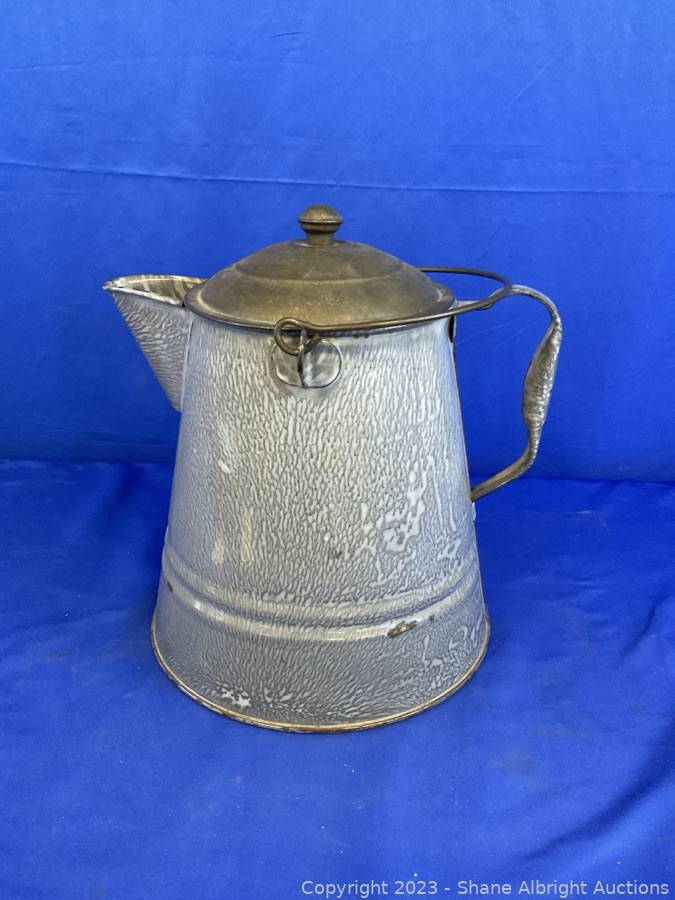 Sold at Auction: White Enamel Cowboy Coffee Pot